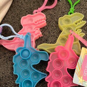 Free‎ Pop It Dinosaur or Unicorn Keychain with $25 Closet Order